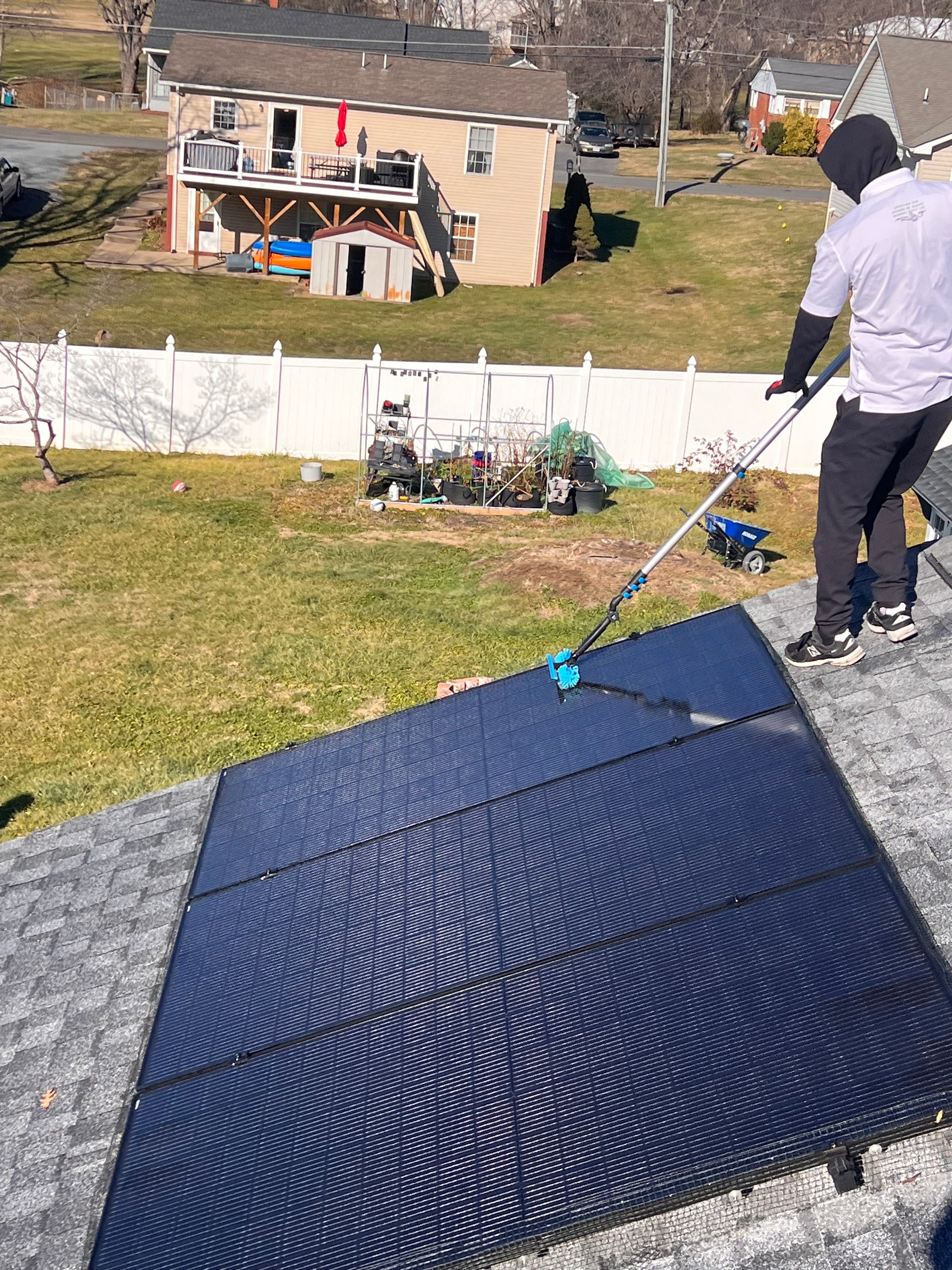 Homeowner enjoying increased solar efficiency after panel cleaning in Virginia.